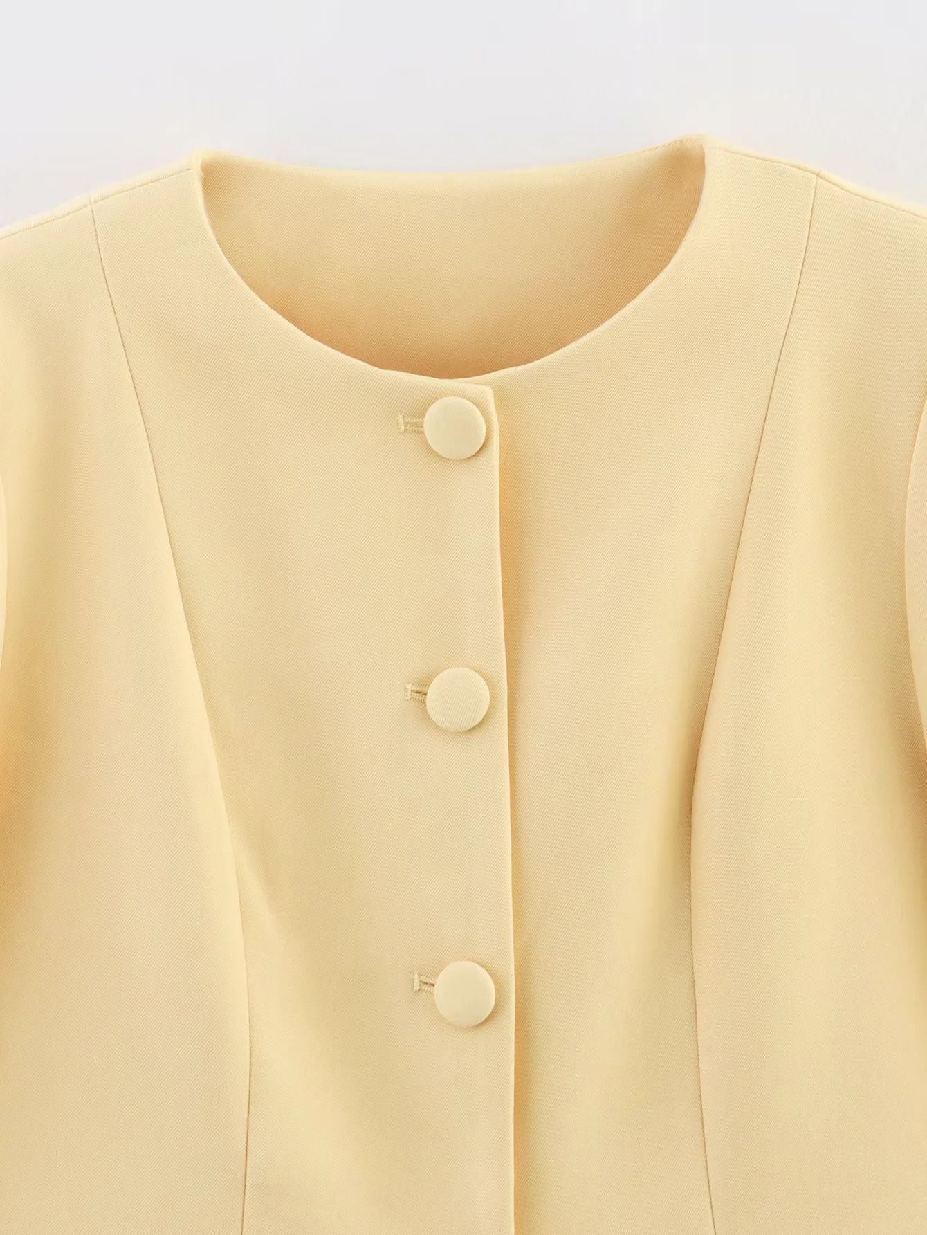 Women's elegant blazer with a fashionable cut and decorative button details NOVAE