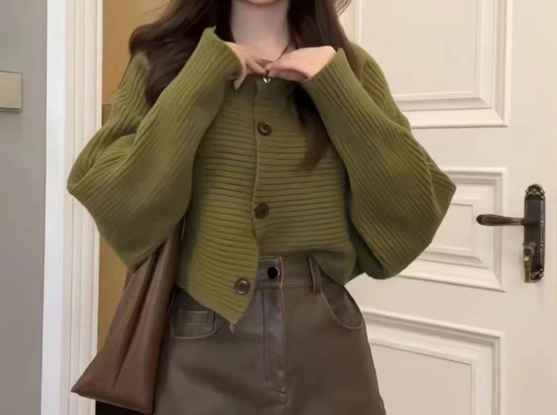 Women's fashionable knitted throw with button detail and structured design NOVAE