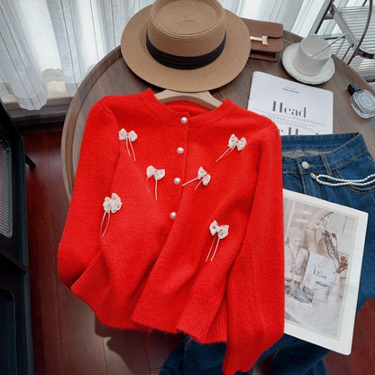 Women's cardigan with feminine appliqués and button details NOVAE