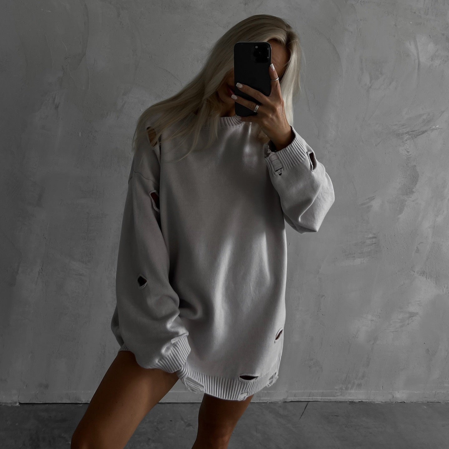 Women's oversized sweatshirt with stylish ripped details and a wide fit NOVAE