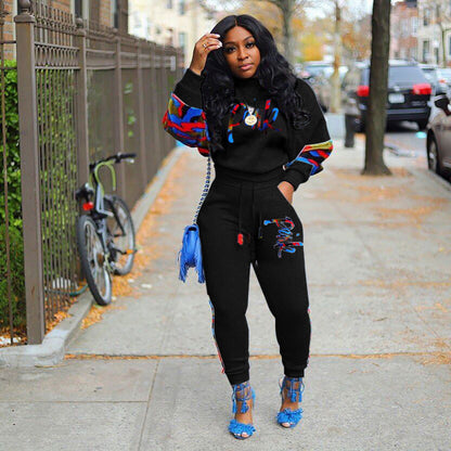 Women's sporty sweatshirt set with colorful camouflage details and a comfortable cut NOVAE