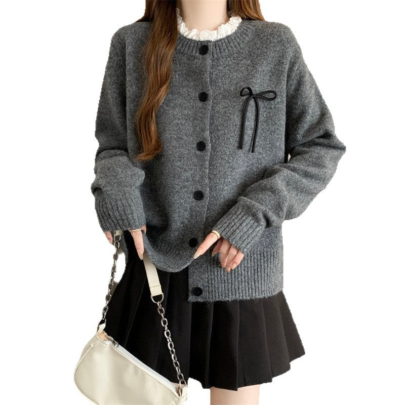 Women's knitted cardigan with decorative buttons and bow accent NOVAE