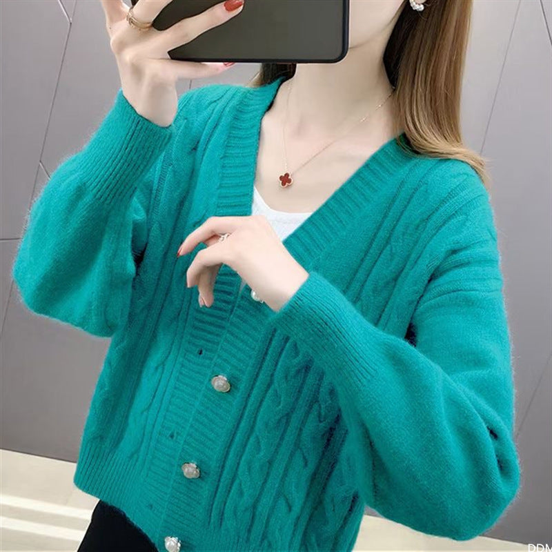 Women's cardigan with elegant cable knit pattern and high-quality button details NOVAE