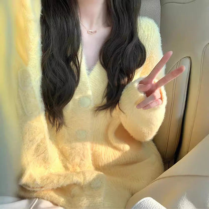 Women's oversized cardigan with soft fleece and special button details NOVAE