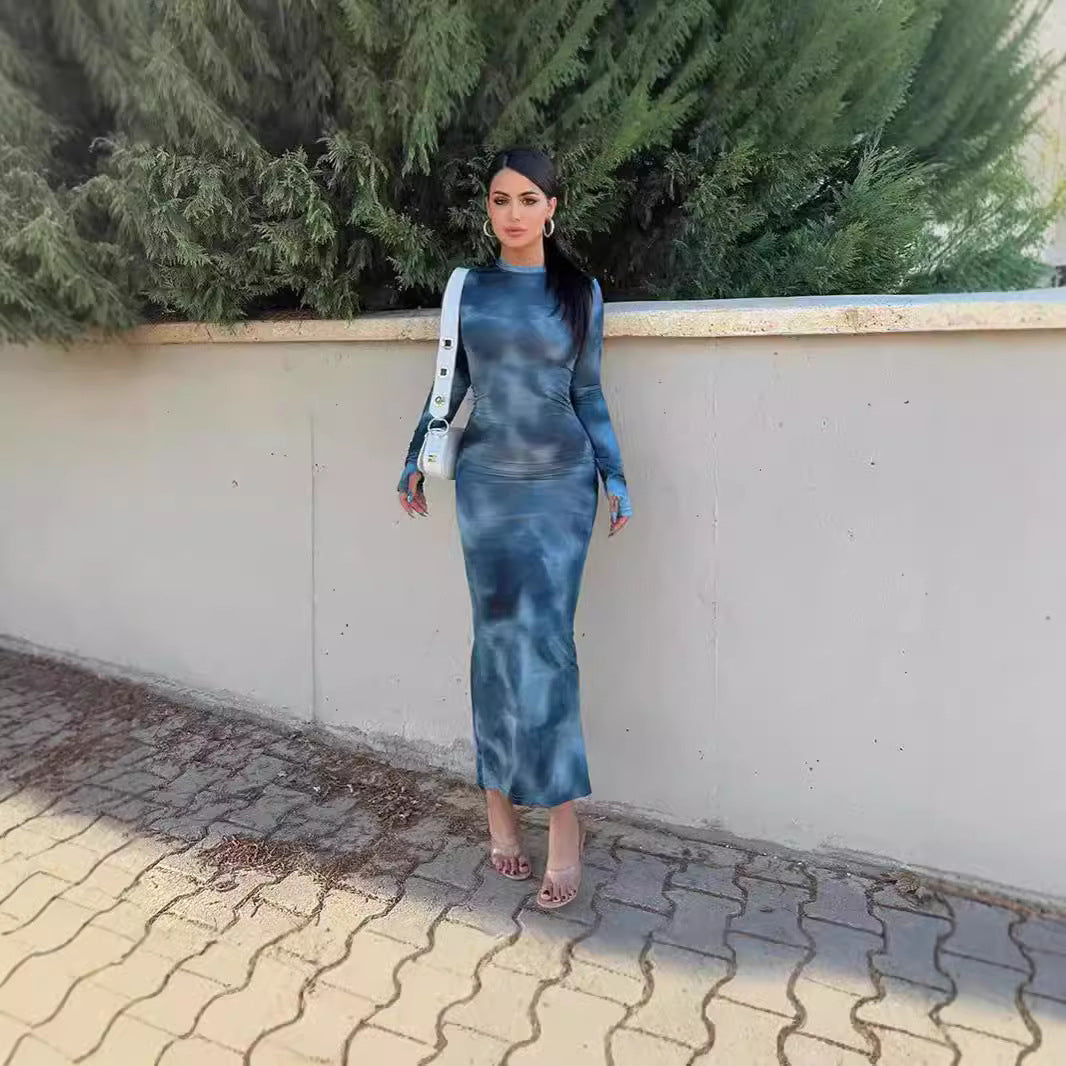 Women's figure-hugging maxi dress with long sleeves and a modern batik pattern NOVAE