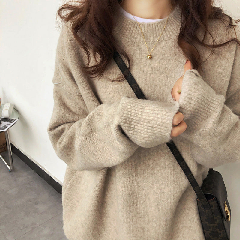 Women's oversized knit sweater with a wide cut and high cuffs NOVAE