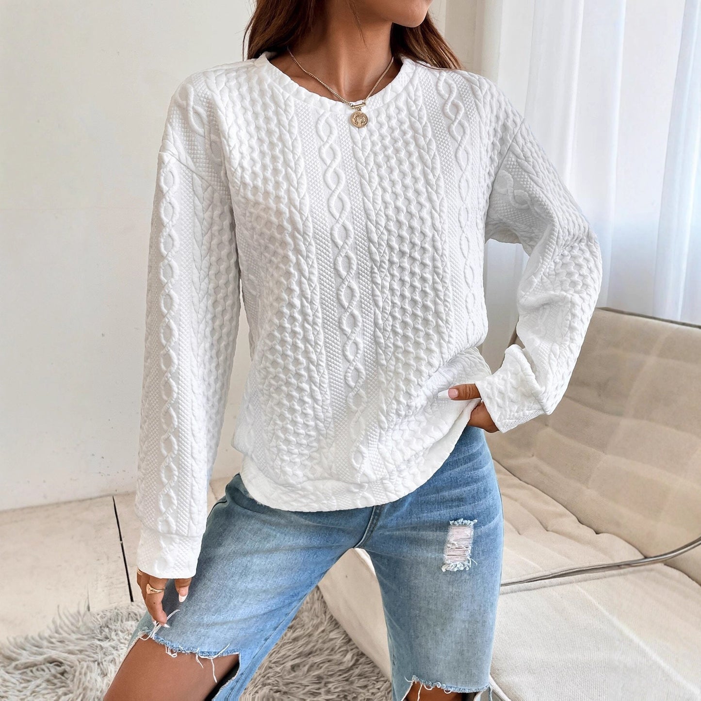 Women's knit sweater with textured surface and elegant round neckline NOVAE