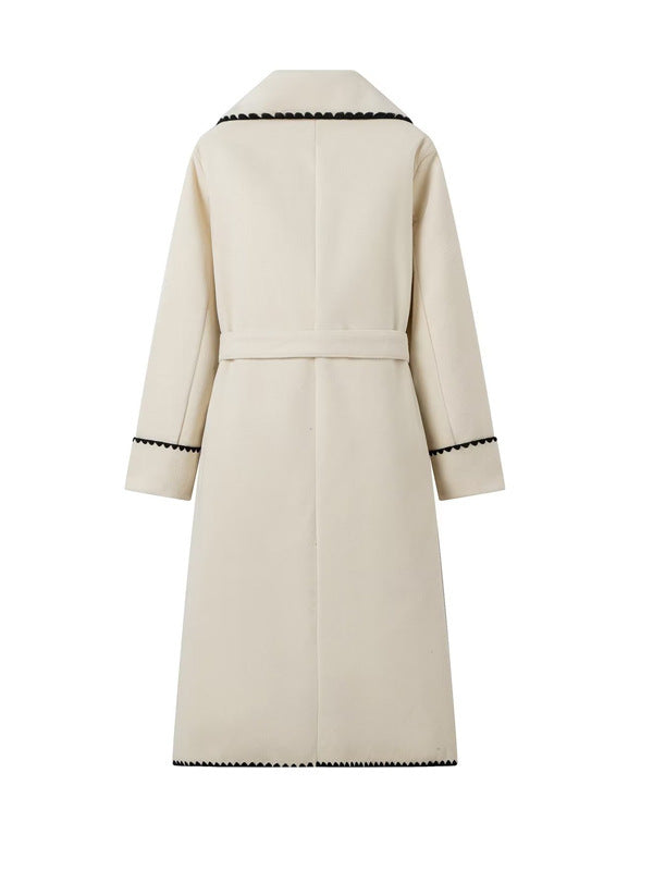 Women's elegant long coat with tie belt and contrasting piping NOVAE
