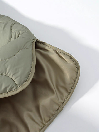 Women's quilted transitional jacket with soft fabric texture and practical snap fasteners NOVAE