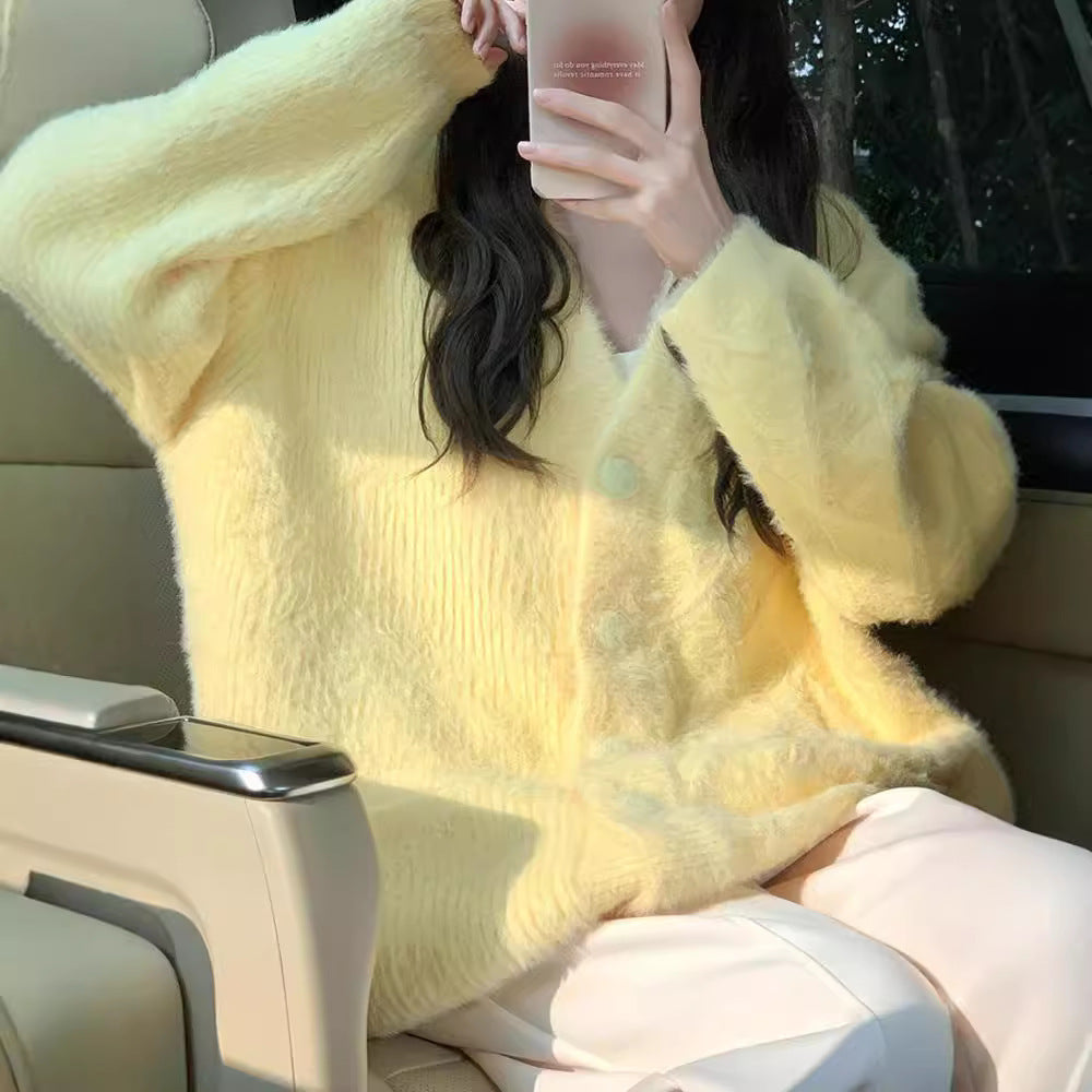 Women's oversized cardigan with soft fleece and special button details NOVAE