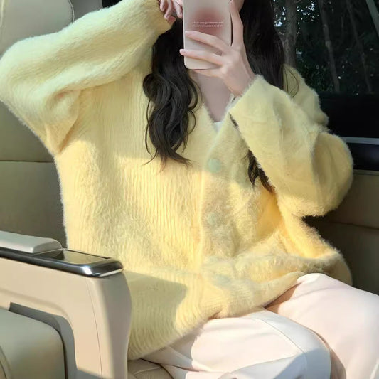 Women's oversized cardigan with soft fleece and special button details NOVAE