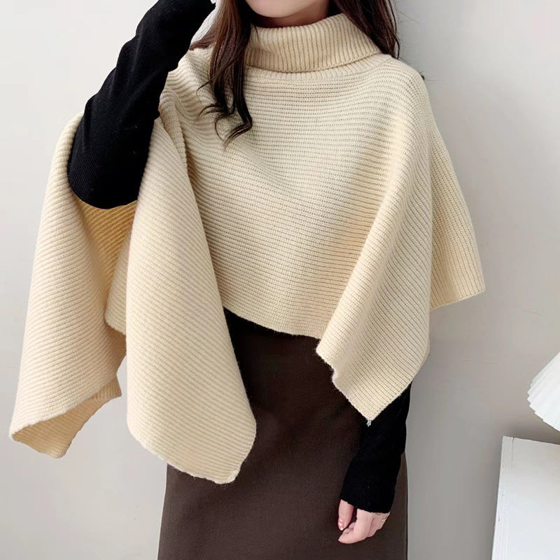 Women's knitted poncho with high collar and elegant ribbed texture NOVAE