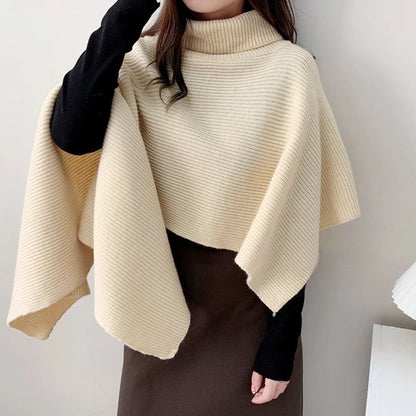 Women's knitted poncho with high collar and elegant ribbed texture NOVAE