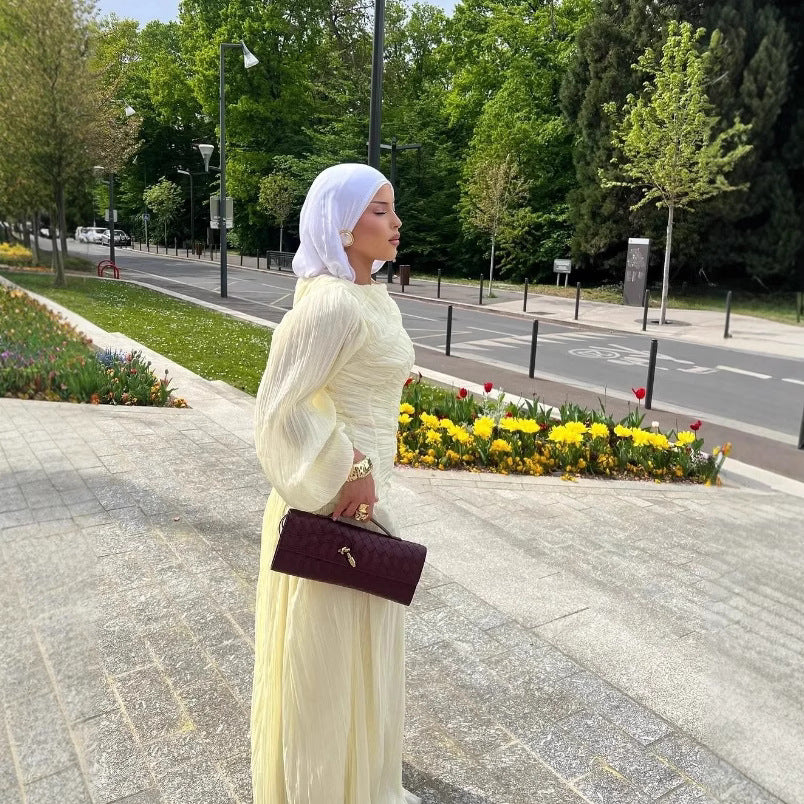 Women's maxi dress with sophisticated pleats and elegant long sleeves NOVAE