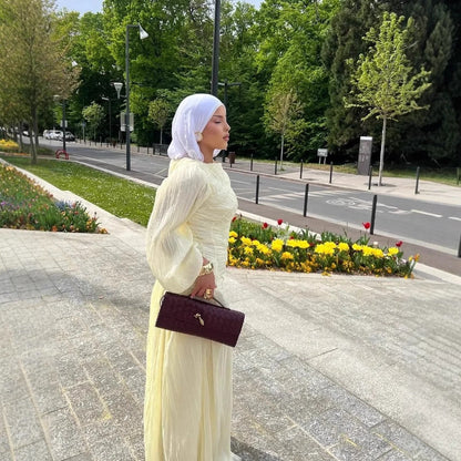 Women's maxi dress with sophisticated pleats and elegant long sleeves NOVAE