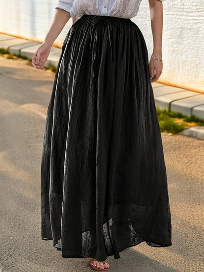 Women's elegant maxi skirt with a flowing cut and practical tie straps NOVAE