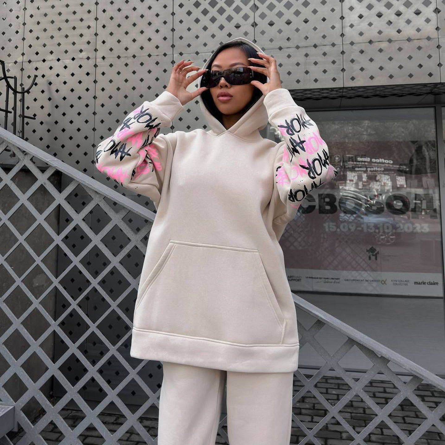 Women's hoodie with creative lettering and unique sleeve graphics NOVAE