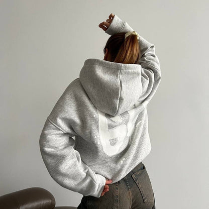 Women's oversized hoodie with a comfortable cut and casual sleeves NOVAE