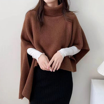 Women's knitted poncho with high collar and elegant ribbed texture NOVAE
