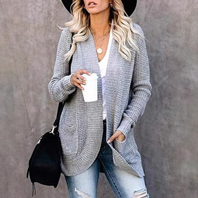 Women's knitted cardigan with practical pockets and airy structure NOVAE