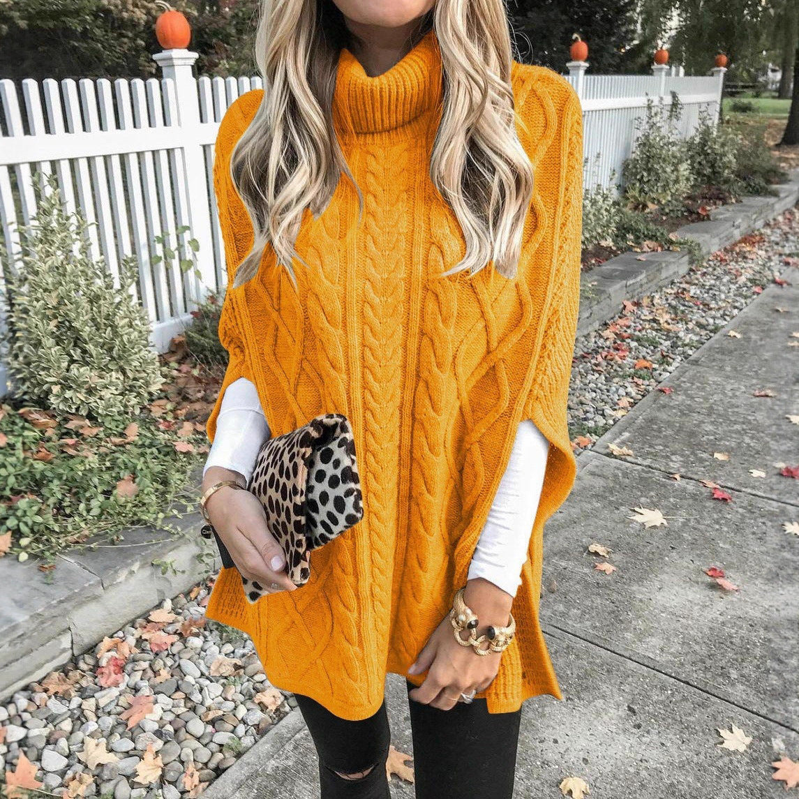 Women's knitted poncho with high collar and decorative cable pattern NOVAE