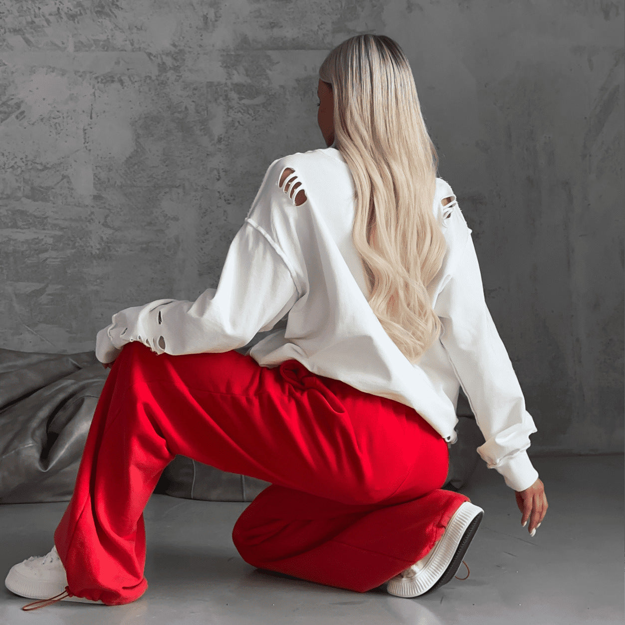 Women's casual oversized sweater with creative ripped details NOVAE