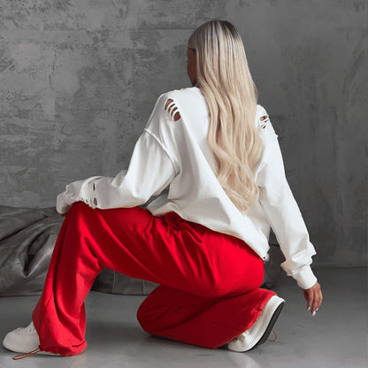 Women's casual oversized sweater with creative ripped details NOVAE