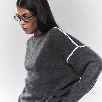 Women's elegant knit sweater with unique ribbed textures and fashionable accents NOVAE