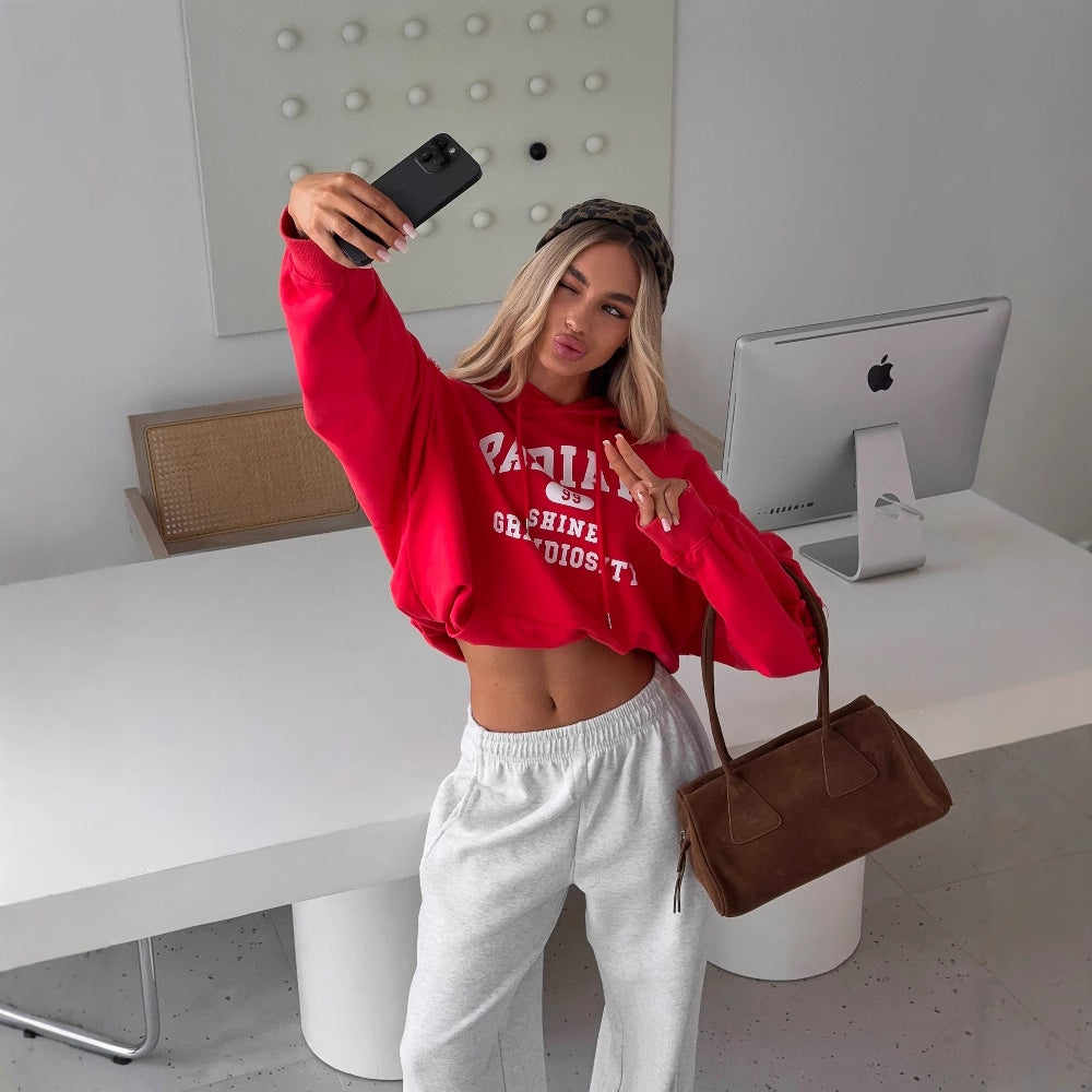 Women's cropped hoodie with creative cut details and large NOVAE lettering