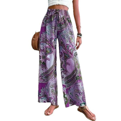 Women's wide-leg palazzo trousers with floral paisley pattern and elasticated waistband NOVAE