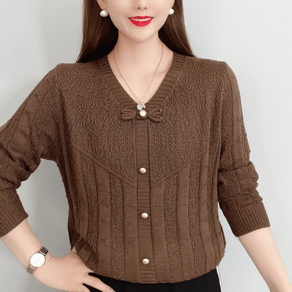 Women's knitted top with decorative pearl buttons and sophisticated bow design NOVAE