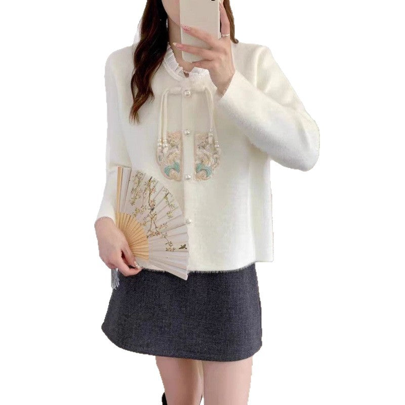 Women's luxury knit sweater with decorative button details and ruffles NOVAE