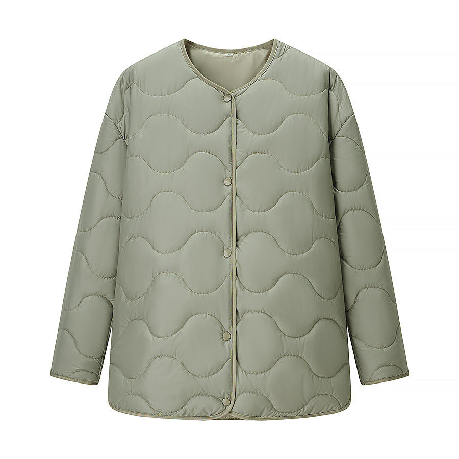 Women's quilted transitional jacket with soft fabric texture and practical snap fasteners NOVAE