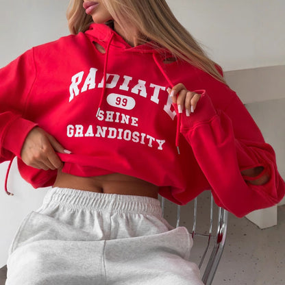 Women's cropped hoodie with creative cut details and large NOVAE lettering