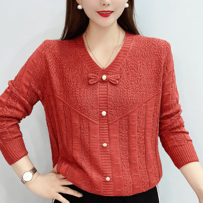 Women's knitted top with decorative pearl buttons and sophisticated bow design NOVAE