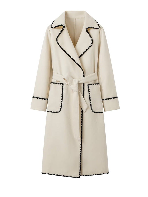 Women's elegant long coat with tie belt and contrasting piping NOVAE