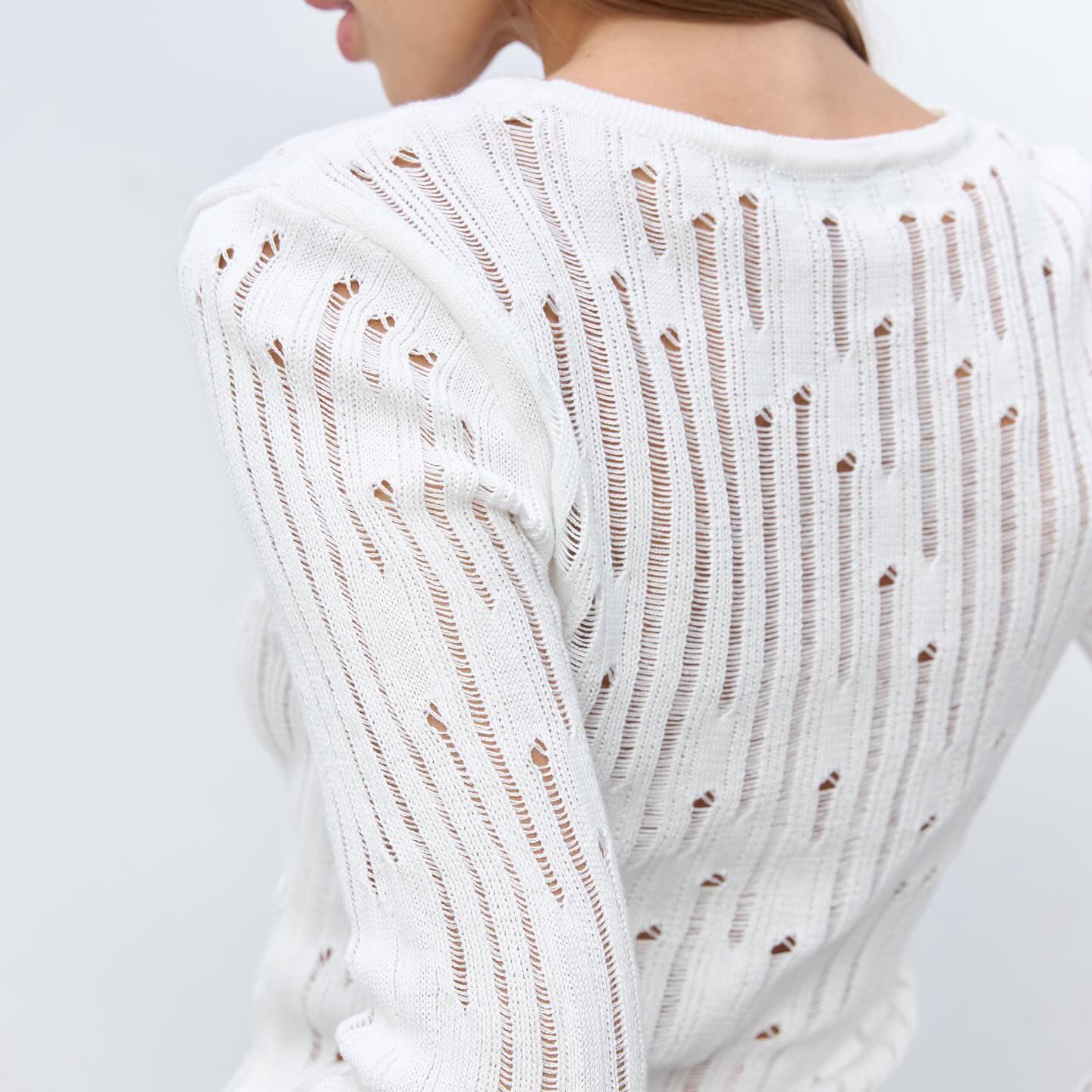 Women's elegant knit sweater with sophisticated openwork pattern and minimalist details NOVAE