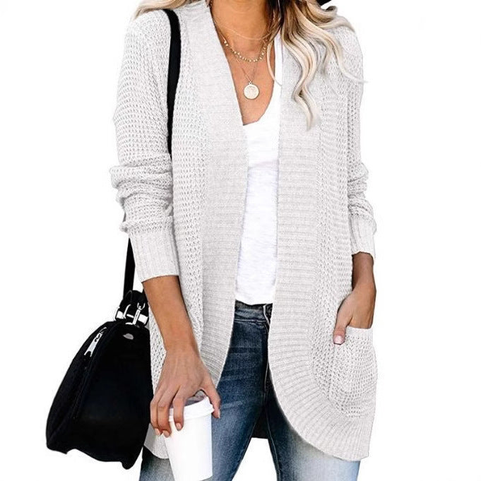 Women's knitted cardigan with practical pockets and airy structure NOVAE