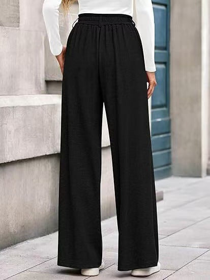 Women's wide-leg trousers with a high waistband and practical side pockets NOVAE