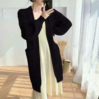 Women's chunky knit cardigan with deep pockets and elegant cable design NOVAE