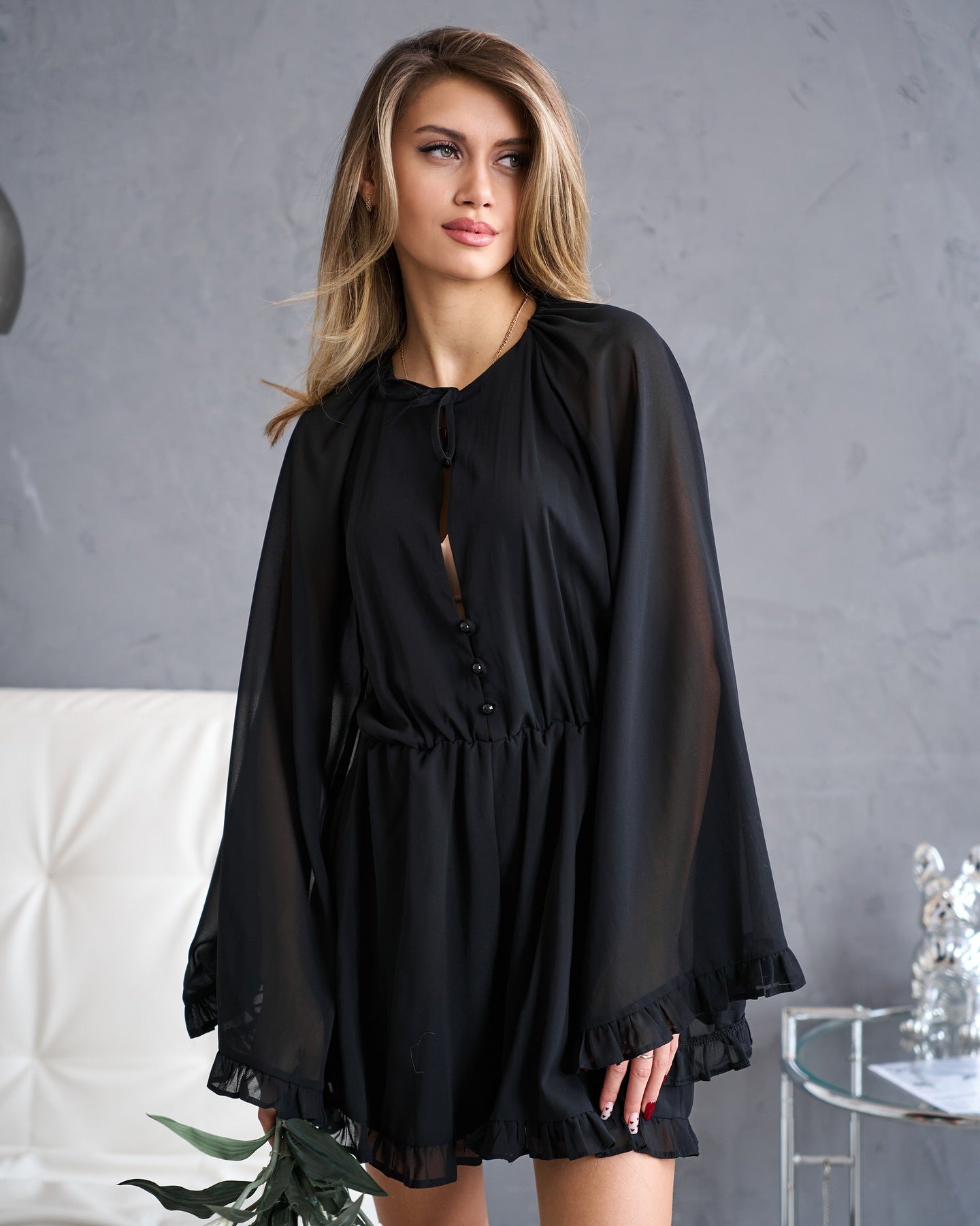 Women's elegant jumpsuit with ruffle details and button-closing V-neck NOVAE