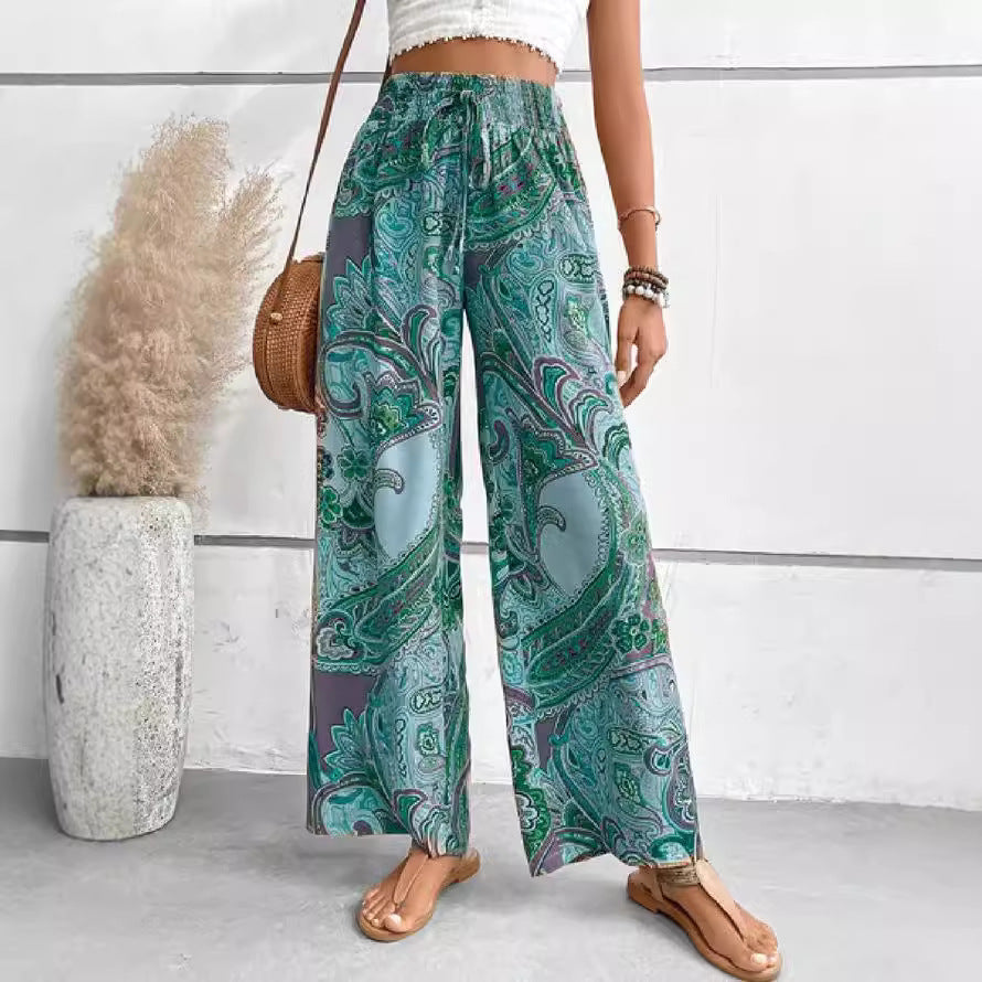 Women's wide-leg palazzo pants with colorful paisley pattern and elastic waistband NOVAE
