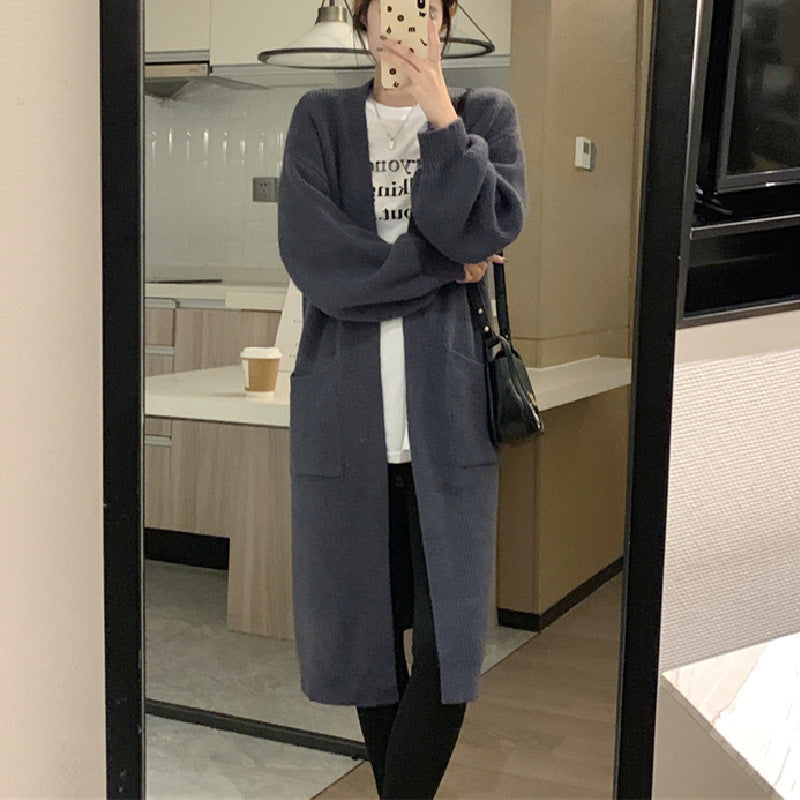 Women's long knit cardigan with practical pockets and elegant silhouette NOVAE