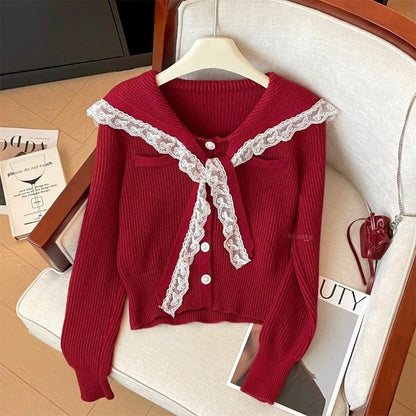 Women's cardigan with ruffled neckband and decorative buttons NOVAE