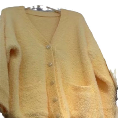 Women's oversized cardigan with soft fleece and special button details NOVAE