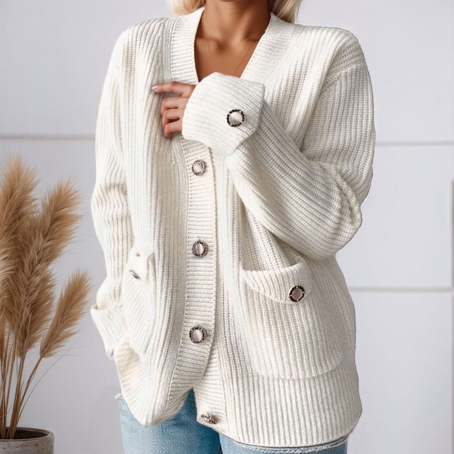 Women's chunky knit cardigan with practical pockets and elegant button details NOVAE