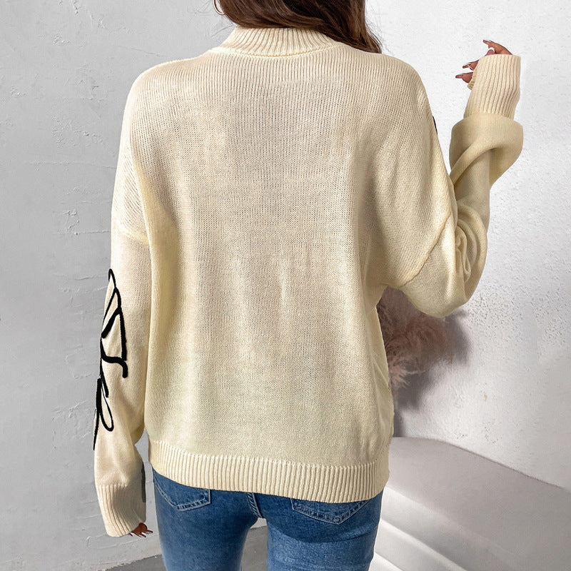 Women's knitted sweater with floral design and high collar NOVAE