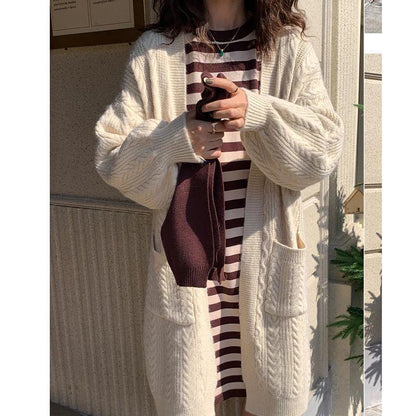 Women's chunky knit cardigan with deep pockets and elegant cable design NOVAE