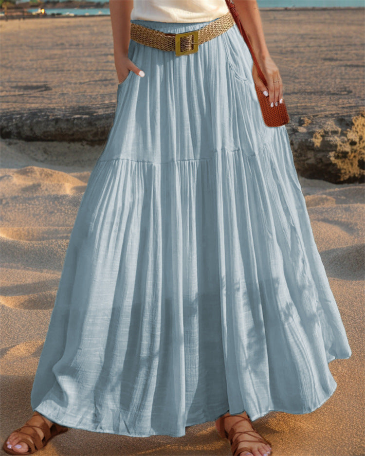 Women's wide-flared maxi skirt with elegant pleats and practical pockets NOVAE