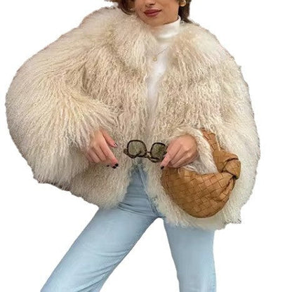 Women's fluffy faux fur jacket in a long cut with wide flared sleeves NOVAE